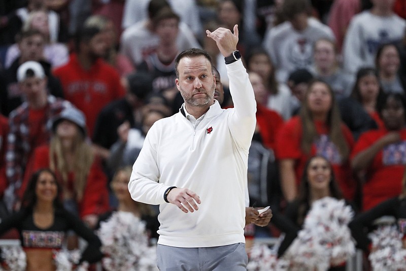 Arkansas State coach Mike Balado calls out to his players during the first half of an NCAA college basketball game against Texas Tech, Tuesday, Dec. 14, 2021, in Lubbock, Texas. (AP Photo/Brad Tollefson)