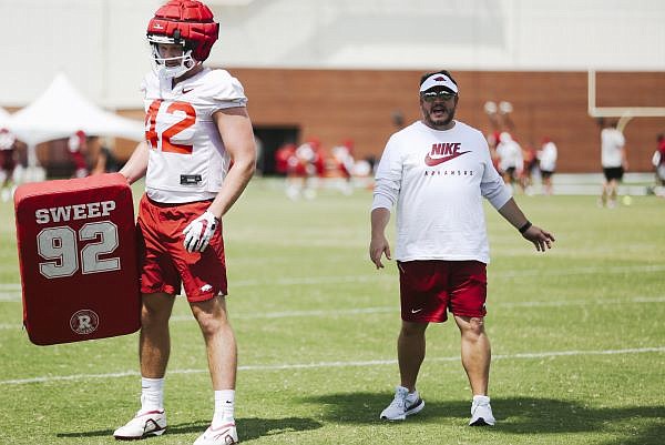 Arkansas tight end coach Dowell Loggains (right) leads a practice, Saturday, August 6, 2022 during a football practice at University of Arkansas practice football field in Fayetteville. Visit nwaonline.com/220807Daily/ for today's photo gallery.......(NWA Democrat-Gazette/Charlie Kaijo)
