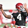 Arkansas quarterback Malik Hornsby passes Friday, Aug. 5, 2022, during practice at the university practice facility in Fayetteville.
