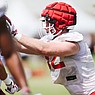Arkansas tight end Hudson Henry (82) goes through a drill on Saturday, August 6, 2022, during a preseason football practice in Fayetteville.