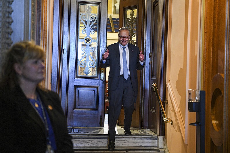 Senate Majority Leader Chuck Schumer (D-N.Y.) gives two thumbs up after Democrats passed a climate, tax and health care spending package on Capitol Hill in Washington on Sunday, Aug. 7, 2022. After a grueling overnight session, the Senate approved the sweeping measure on Sunday, with Vice President Kamala Harris casting the tie-breaking vote. (Kenny Holston/The New York Times)