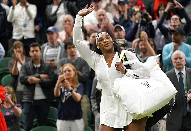 FILE - Serena Williams waves as she leaves the court after losing to France's Harmony Tan in a first round women's singles match on day two of the Wimbledon tennis championships in London, Tuesday, June 28, 2022. (AP/Alberto Pezzali)