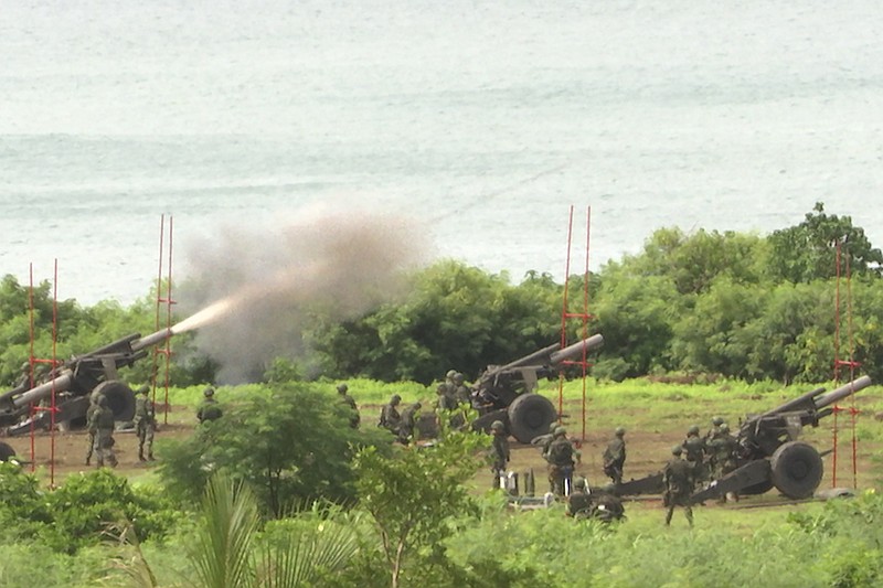 Taiwan's military conducts artillery live-fire drills at Fangshan township in Pingtung, southern Taiwan, Tuesday, Aug. 9, 2022. Taiwan's official Central News Agency reported that Taiwan's army will conduct live-fire artillery drills in southern Pingtung county on Tuesday and Thursday, in response to the Chinese exercises. (AP Photo/Johnson Lai)