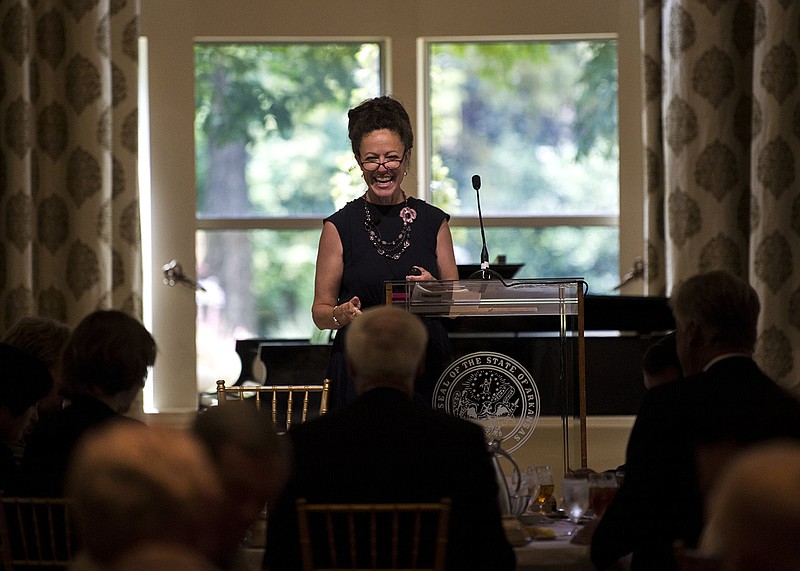 Janine A. Parry, professor of political science at the University of Arkansas, Fayetteville, enjoys a light moment Wednesday while speaking to the Political Animals Club at the Governor’s Mansion in Little Rock.
(Arkansas Democrat-Gazette/Stephen Swofford)
