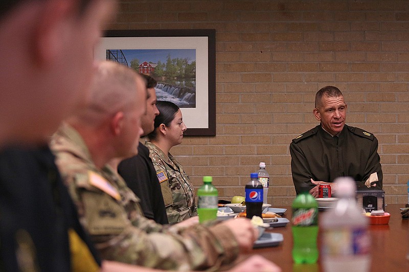 U.S. Army Sgt. Major Michael Grinston, right, talks with a group of military personnel during a stop at Camp Robinson to discuss recruitment goals and challenges Tuesday, August 9, 2022. (Arkansas Democrat-Gazette/Colin Murphey)