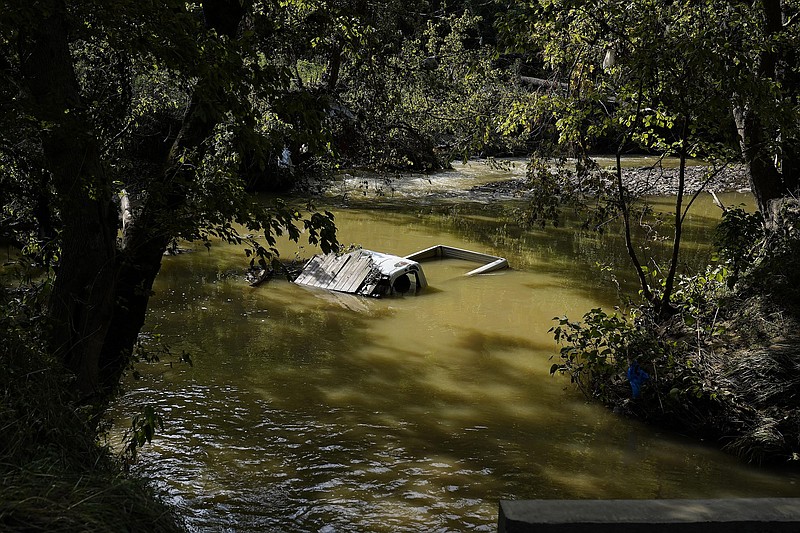 A truck is sunk in water earlier this month after flooding in Hindman, Ky.
(AP/Brynn Anderson)