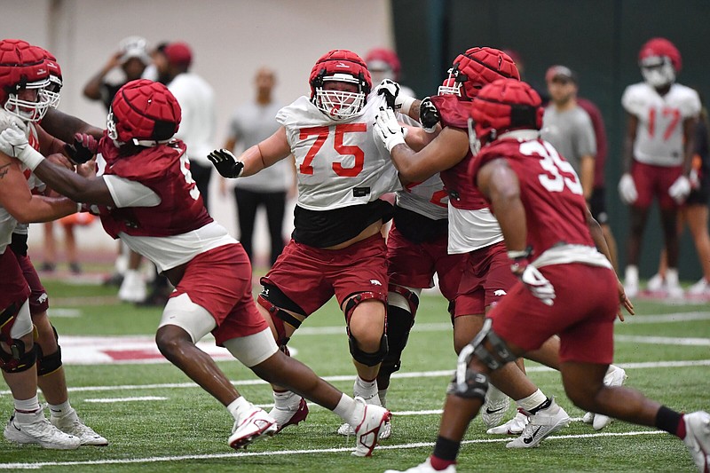 Arkansas freshman offensive lineman Patrick Kutas (75) made the transition from the defensive line before his senior season at Christian Brothers School in Memphis believing it was to his advantage. “It just hit me and I felt like I had a better ceiling as an O-lineman,” Kutas said.
(NWA Democrat-Gazette/Andy Shupe)
