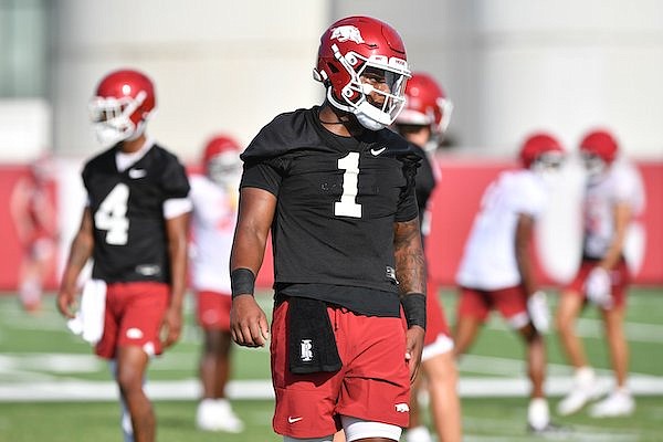 Arkansas quarterback KJ Jefferson works Friday, Aug. 5, 2022, alongside Malik Hornsby during practice at the university practice facility in Fayetteville.