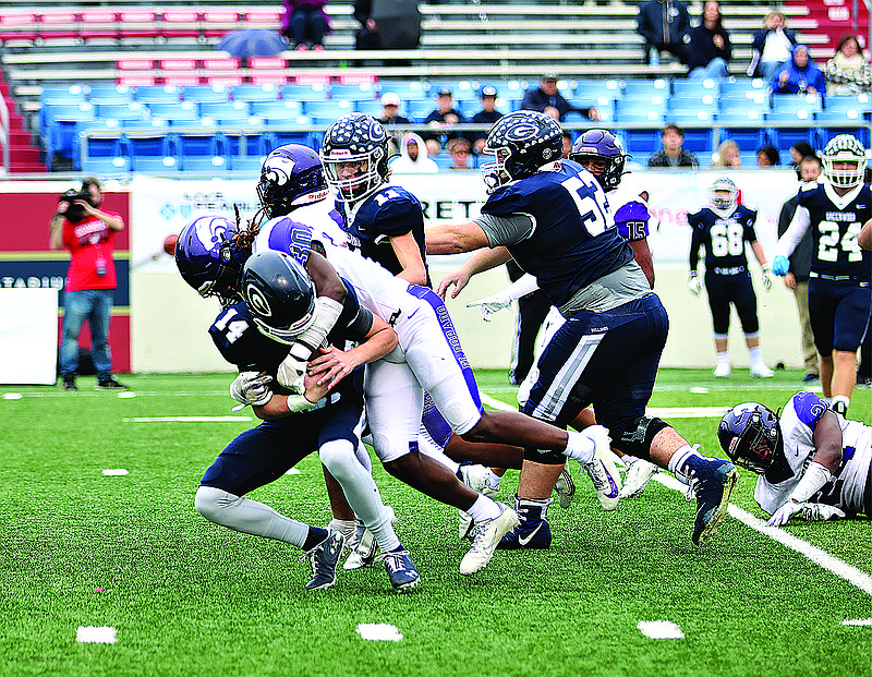 El Dorado's Danquez Shelton brings down a Greenwood ball carrier during the 6A state championship game last season at War Memorial Stadium.