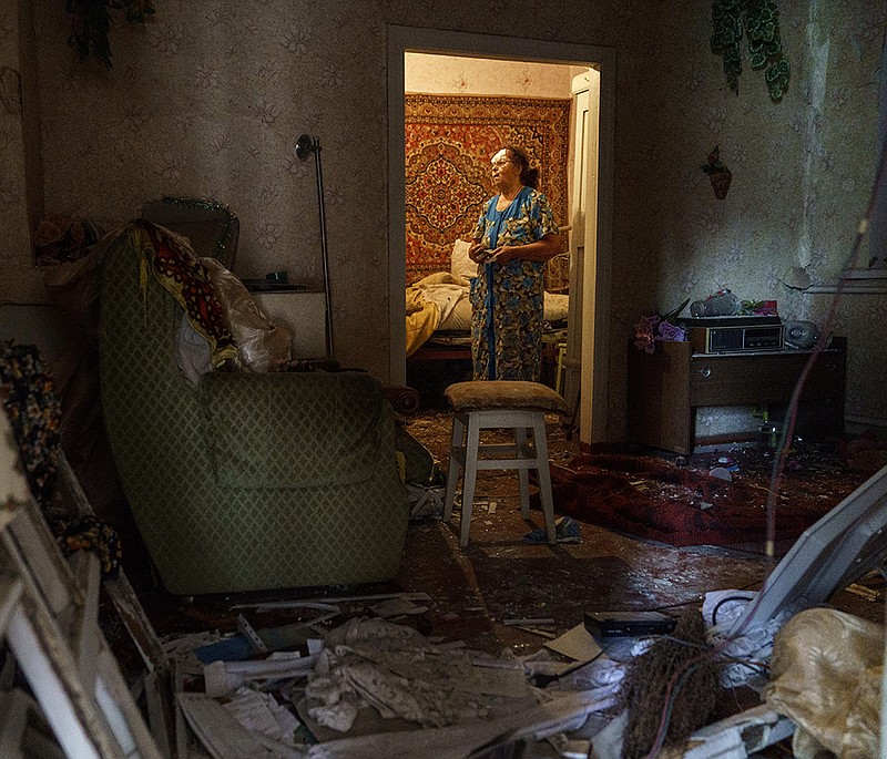 Valentyna Kondratieva, 75, stands in her home Saturday in Kramatorsk in eastern Ukraine, where she was injured in an overnight missile attack, the second in two days. The mayor said three people were killed. More photos at arkansasonline.com/ukrainemonth6/.
(AP/David Goldman)