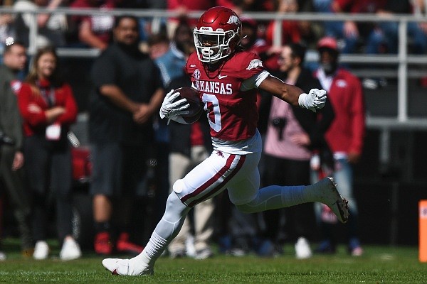 Arkansas running back AJ Green (0) carries the ball, Saturday, October 16, 2021, during the third quarter of a football game at Reynolds Razorback Stadium in Fayetteville.