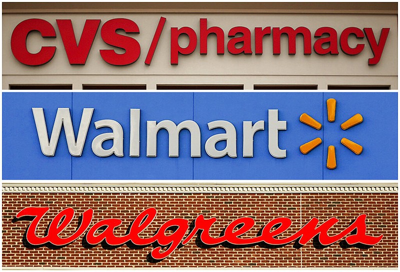 FILE - This undated combination of file photos show the signs of CVS, Walmart and Walgreens. (AP/File)
