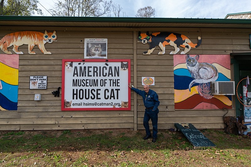 Photo courtesy of visitnc.com / Founder and curator Dr. Harold Sims stands in front of the American Museum of the House Cat in Sylva, North Carolina.
