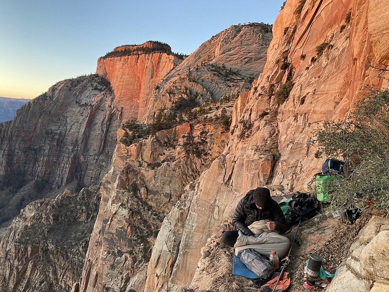 Photo contributed by Ky Hart / Mike Dunn eats breakfast at “camp” on the fourth day of his and Ky Hart’s ascent of the Altar of Sacrifice’s east wall in Utah.