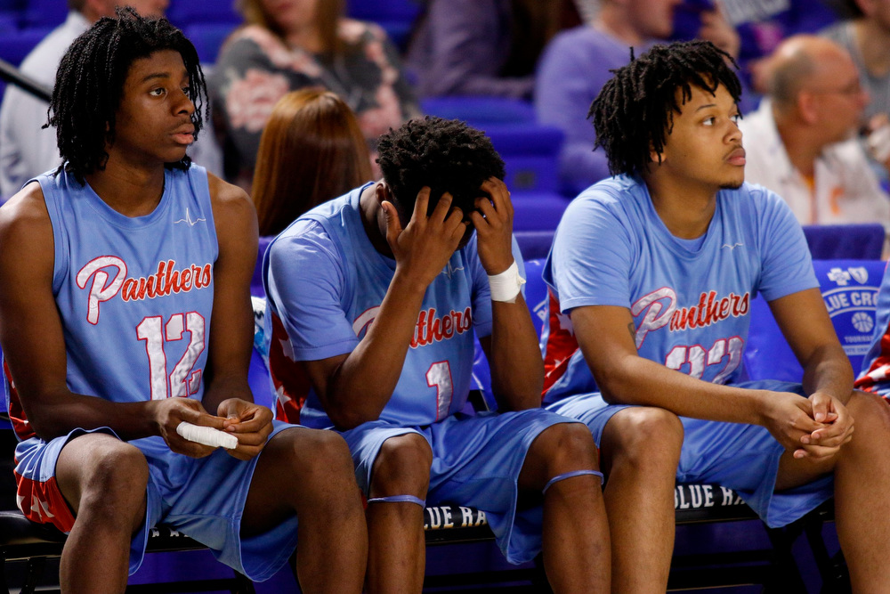 Staff photo by Doug Strickland / .Brainerd's Xiyeer Lattimore (12), Remeo Hubbard (1) and Cameron Evans (32) react as the Panthers trail in their TSSAA Class AA state basketball tournament semifinal game against the Wooddale Cardinals at Murphy Center on the campus of Middle Tennessee State University on Friday, March 15, 2019, in Murfreesboro, Tenn.