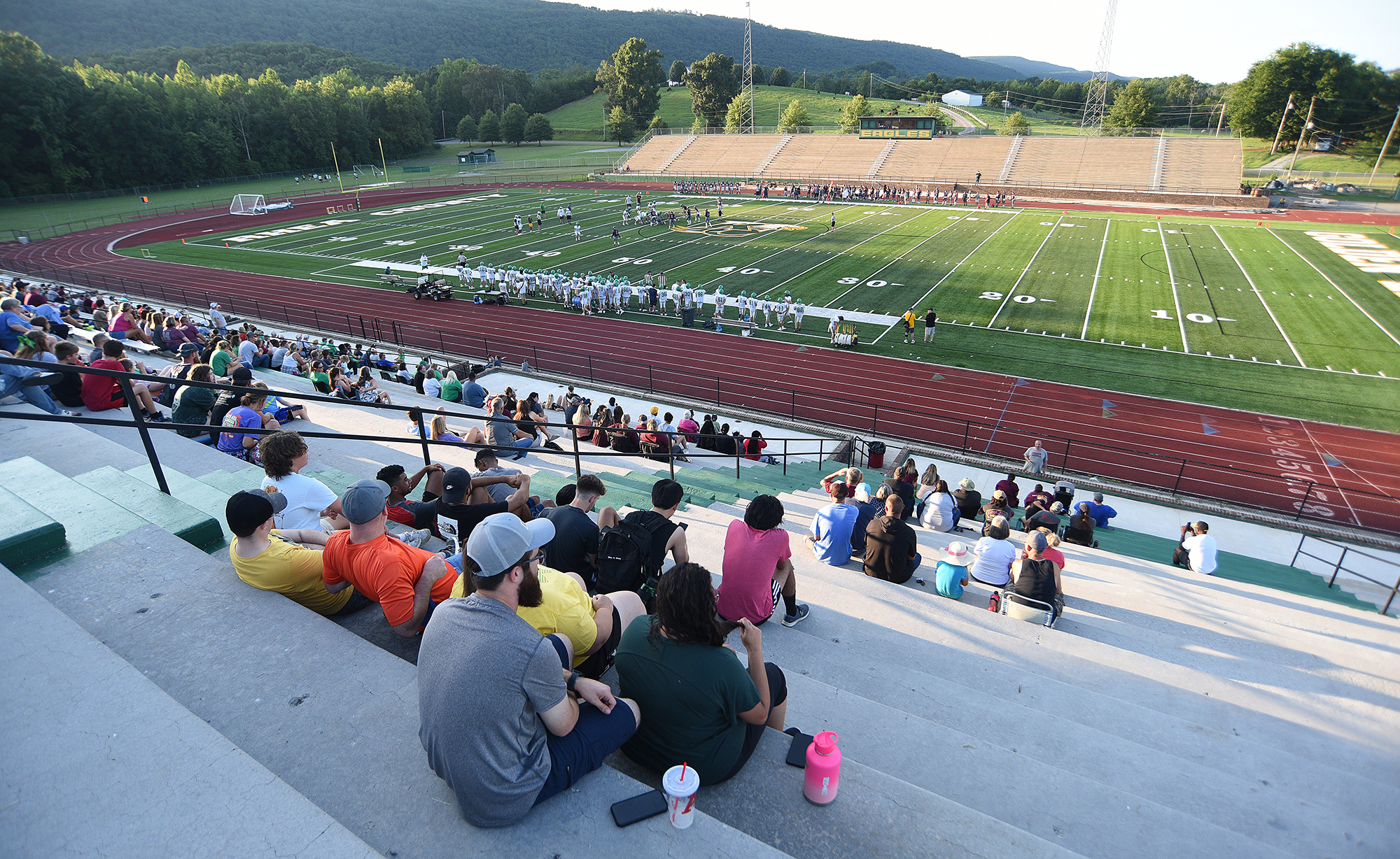 Staff photo by Matt Hamilton / Fans watch the scrimmage between White County and Rhea County High School at Rhea County High School on Tuesday, August 2, 2022.
