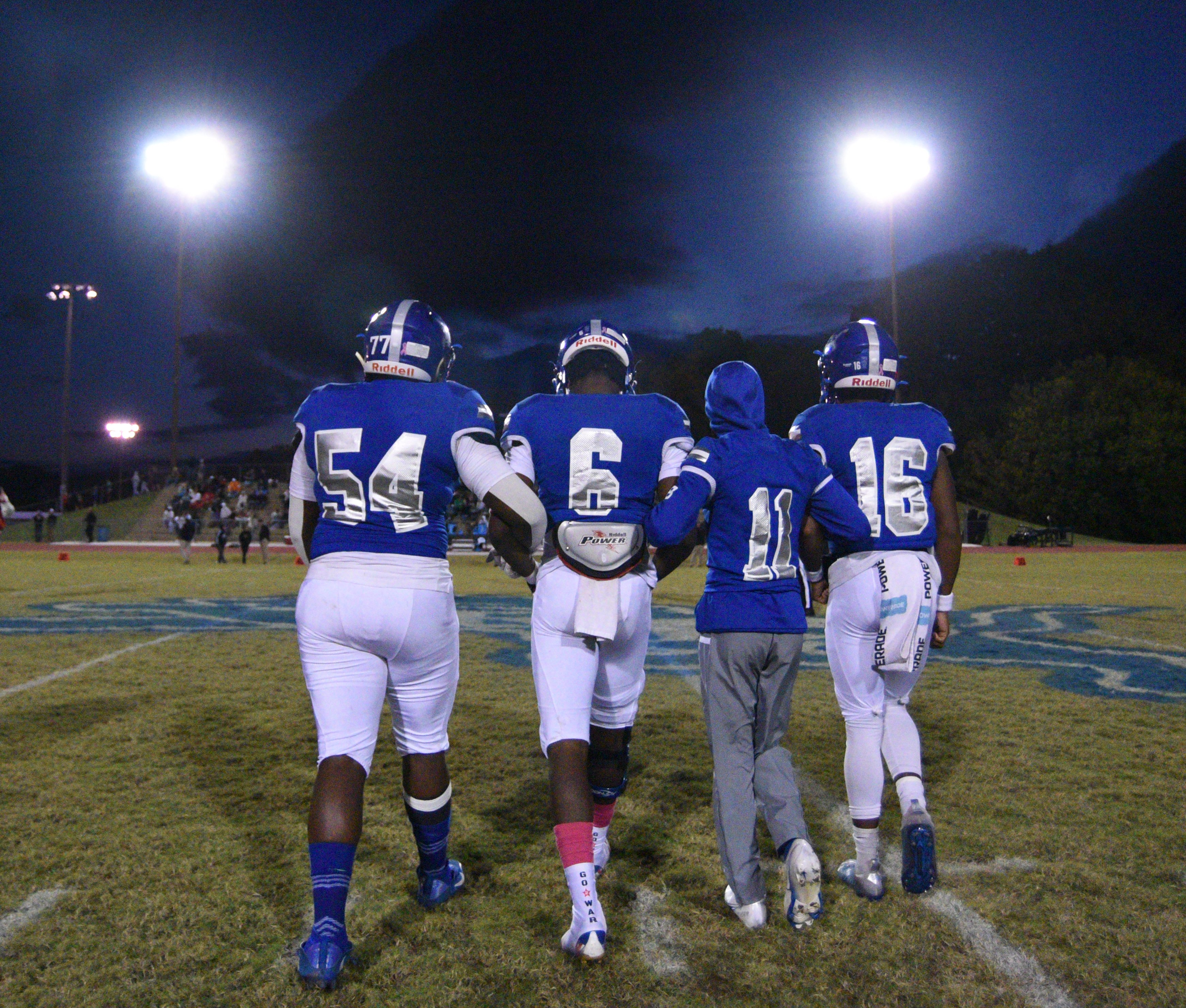 Staff Photo by Matt Hamilton / Red Bank team captains walk out for the coin toss at Red Bank High School on Friday, October 22, 2021. Red Bank hosted East Hamilton on Friday in Red Bank's homecoming game.