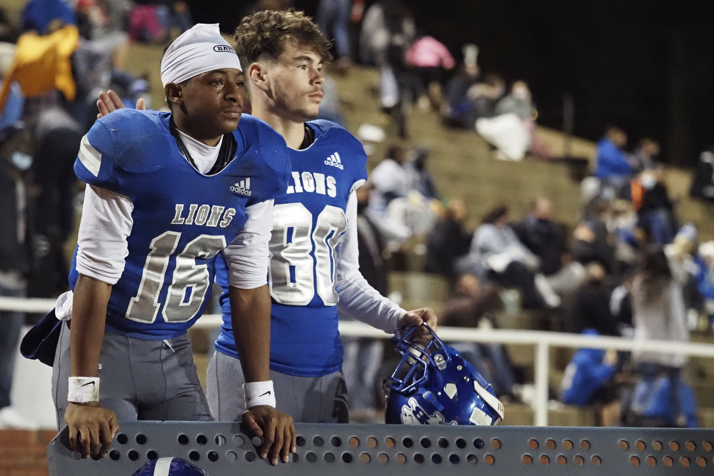 Staff photo by C.B. Schmelter / Red Bank's Jake Wright (80) comforts teammate Joseph Blackmon (16) during the Class 3A semifinals against Alcoa at Red Bank Community Stadiumon Friday, Nov. 27, 2020 in Chattanooga, Tenn.