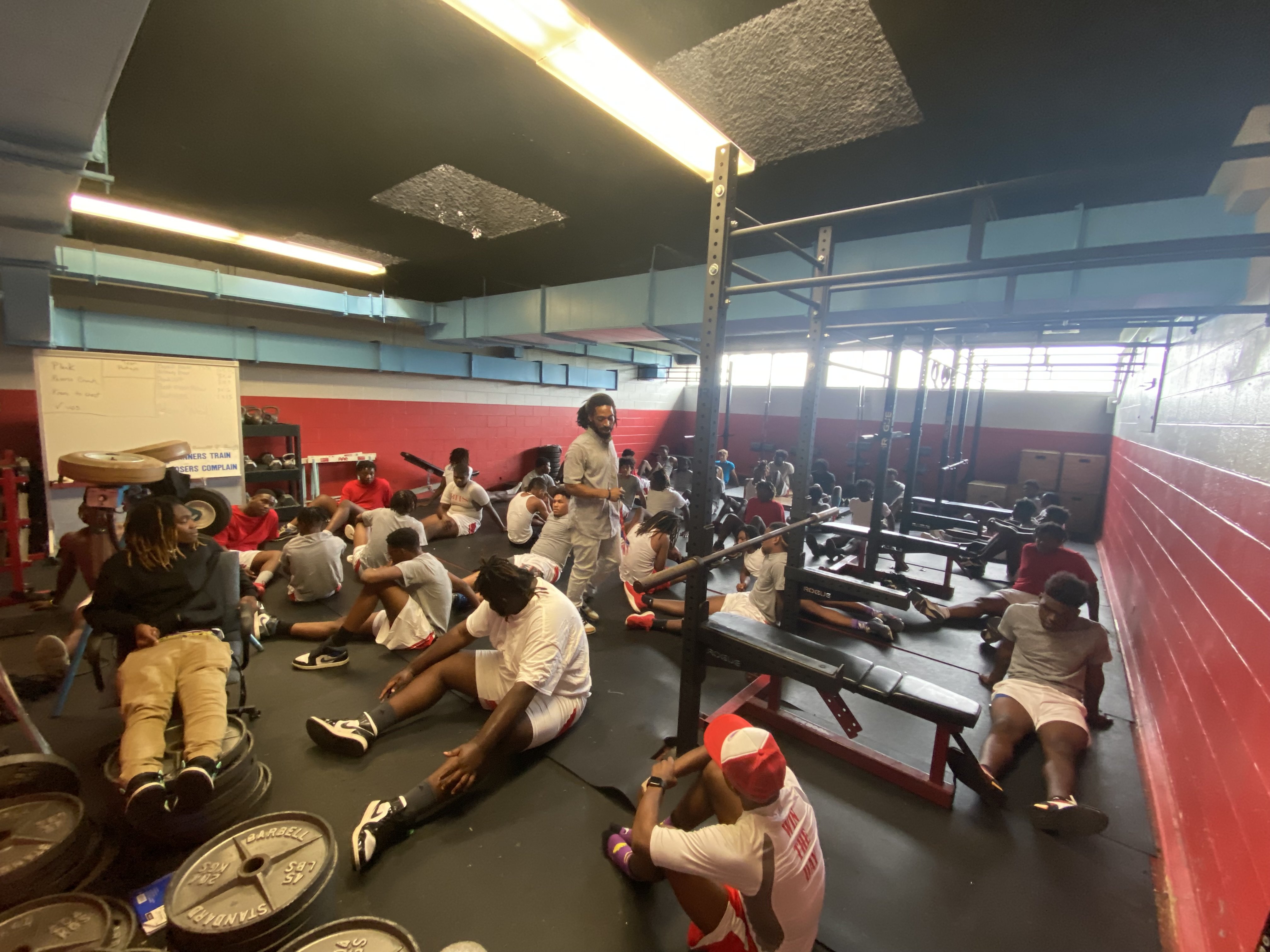 Staff Photo by Stephen Hargis / Brainerd High School strength and conditioning coach Cortez Mosby oversees the football team's morning workouts inside their weight room.