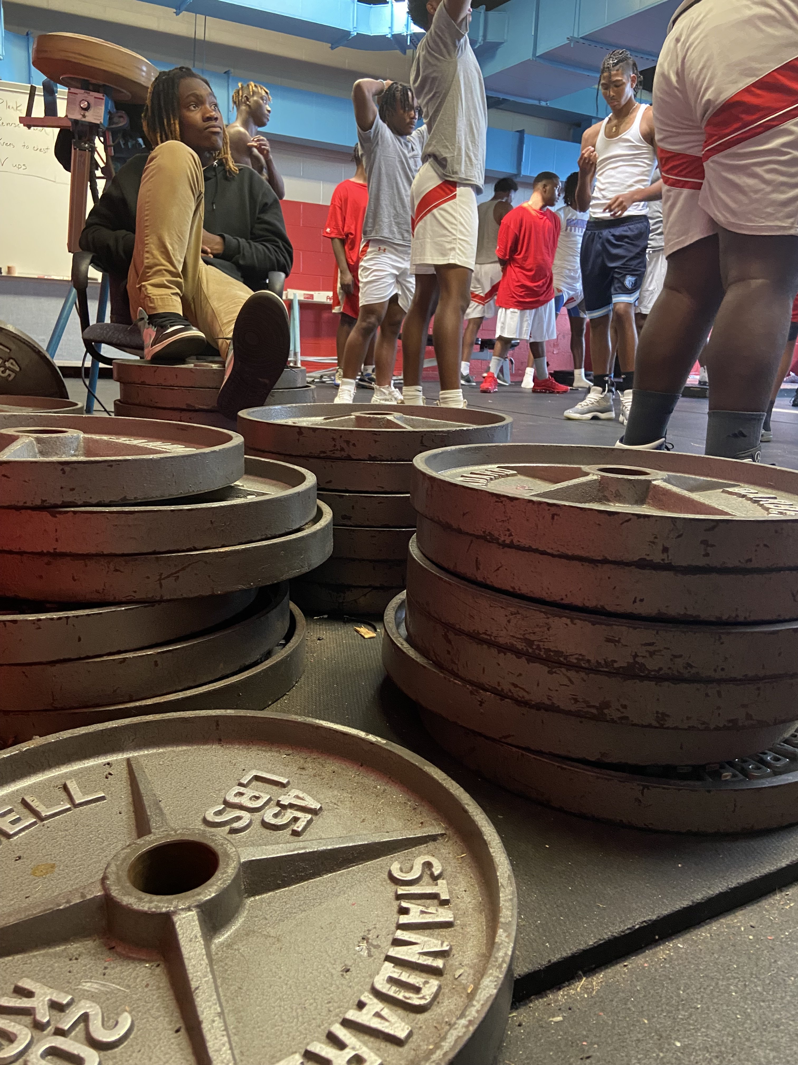 Staff Photo by Stephen Hargis / Brainerd High School strength and conditioning coach Cortez Mosby oversees the football team's morning workouts inside their weight room.