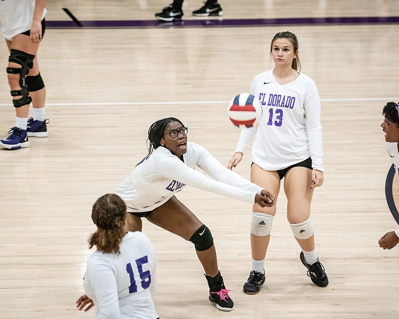 El Dorado's Diana Obiozo calls for the ball as teammates, including Dakoda Jones (13) provide support. The Lady Wildcats fell to Magnolia 3-1 in the volleyball opener Monday at Wildcat Arena.