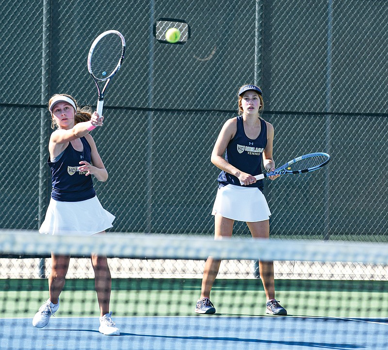 Helias teammates Hannah (left) and Catie Meystrik take part in sectional play last season at the Crusader Athletic Complex. (Julie Smith/News Tribune)