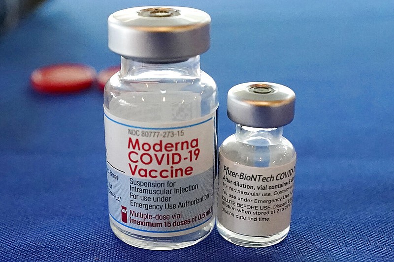 FILE - This Sept. 21, 2021 file photo shows vials of the Pfizer and Moderna covid-19 vaccines in Jackson, Miss. (AP/Rogelio V. Solis, File)