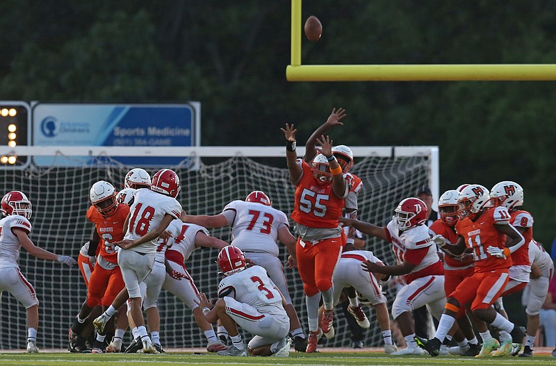 Elijah Roberts (55), center, tries to block a point after attempt for Little Rock Hall at home against Dardanelle on Friday, August 26, 2022. See more photos at arkansasonline.com/827hsfootball/ (Arkansas Democrat-Gazette/Colin Murphey) .. Elijah Roberts (55), center, tries to block a point after attempt for Little Rock Hall at home against Dardanelle on Friday, August 26, 2022. See more photos at arkansasonline.com/827hsfootball/ (Arkansas Democrat-Gazette/Colin Murphey) ..