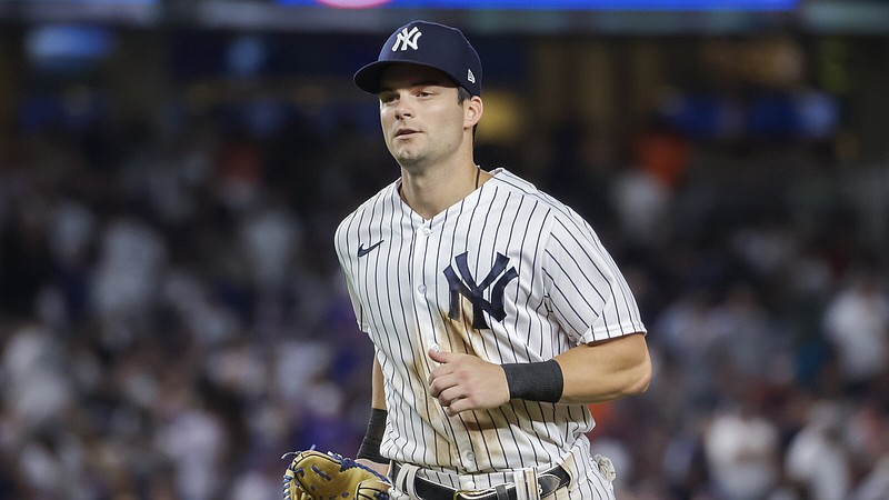 New York Yankees' Andrew Benintendi runs toward the dugout in the seventh inning of a baseball game against the New York Mets, Monday, Aug. 22, 2022, in New York. (AP Photo/Corey Sipkin)