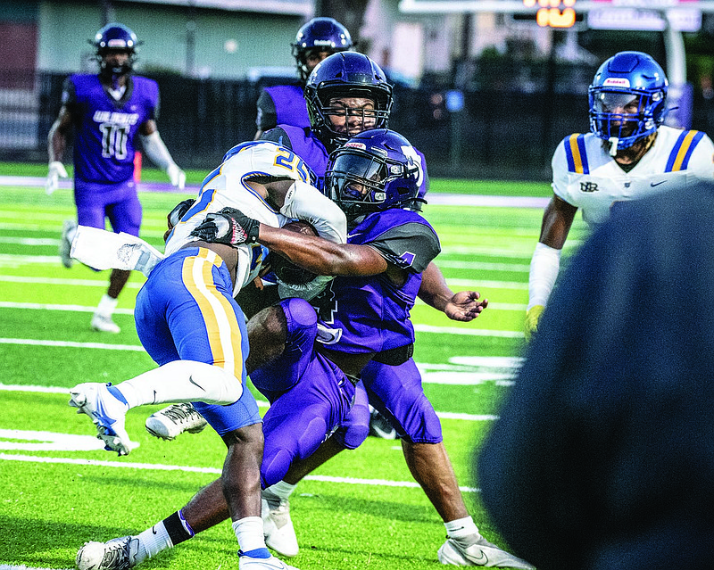 El Dorado's Jordan Ford makes a tackle against North Little Rock during the benefit game at Memorial Stadium this season.