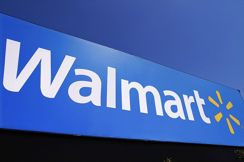 The Walmart logo is displayed on a store in Springfield, Ill., May 16, 2011.(AP/Seth Perlman)