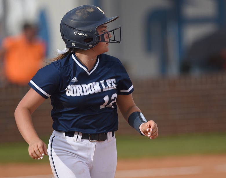 Staff photo by Matt Hamilton / Gordon Lee (12) Gracie Helton watches her ball fly to the outfield against Ringgold on Tuesday, August 30, 2022 at Ringgold High School.