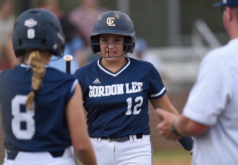 Staff photo by Matt Hamilton / Gordon Lee (12) Gracie Helton returns to the dugout after scoring on Tuesday, August 30, 2022 at Ringgold High School.