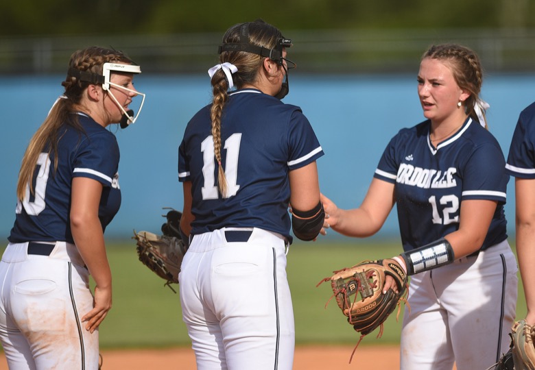 Staff photo by Matt Hamilton / Gordon Lee (10) Tenslee Wilson, (11) Sydney Garrett and (12) Gracie Helton talk at the start of an inning on Tuesday, August 30, 2022 at Ringgold High School.