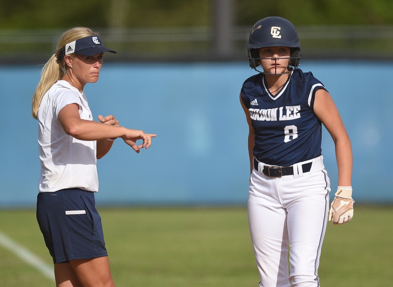 Staff photo by Matt Hamilton / Gordon Lee head coach Dana Mull talks to Gordon Lee (8) Lillian McCullough as she stands on third on Tuesday, August 30, 2022 at Ringgold High School.