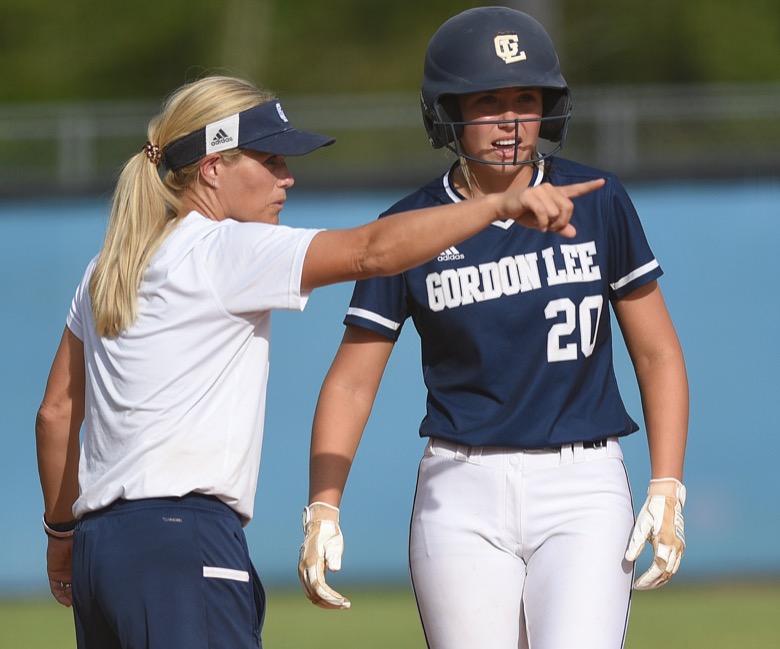 Staff photo by Matt Hamilton / Gordon Lee head coach Dana Mull talks to Gordon Lee (20) Kate Chambers as she stands on third on Tuesday, August 30, 2022 at Ringgold High School.