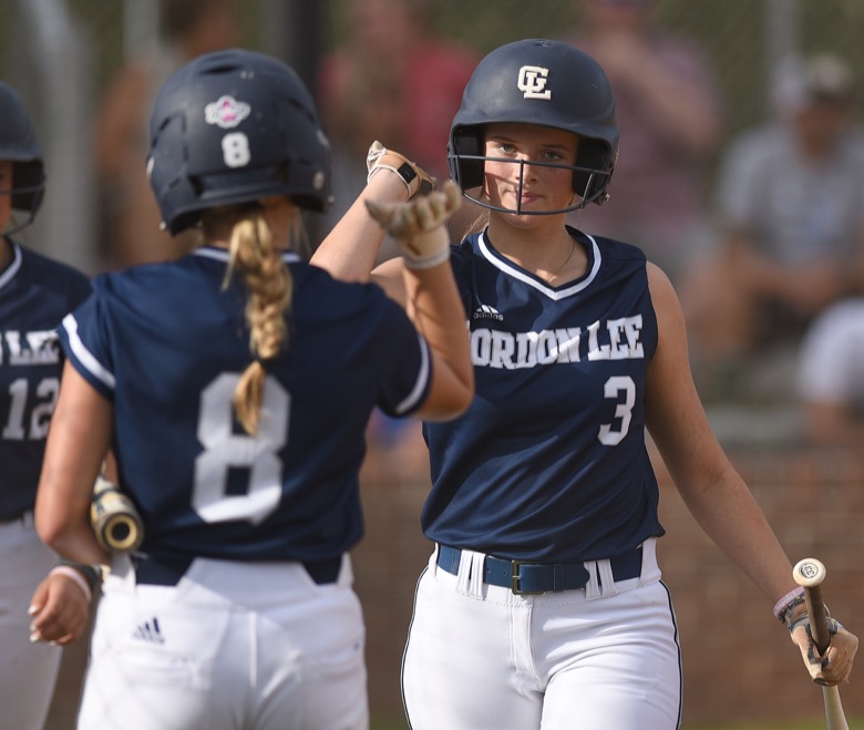 Staff photo by Matt Hamilton / Gordon Lee (3) Emma Phillips returns to the dugout after scoring on Tuesday, August 30, 2022 at Ringgold High School.