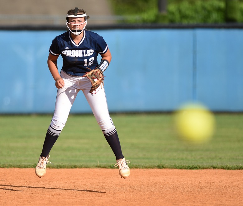 Staff photo by Matt Hamilton / Gordon Lee (12) Gracie Helton hops in the air as the pitch flies toward home plate during a game against Ringgold on Tuesday, August 30, 2022 at Ringgold High School.