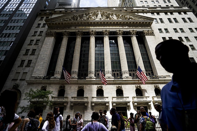 FILE - Pedestrians walk past the New York Stock Exchange on July 8, 2022, in New York. (AP/John Minchillo, File)
