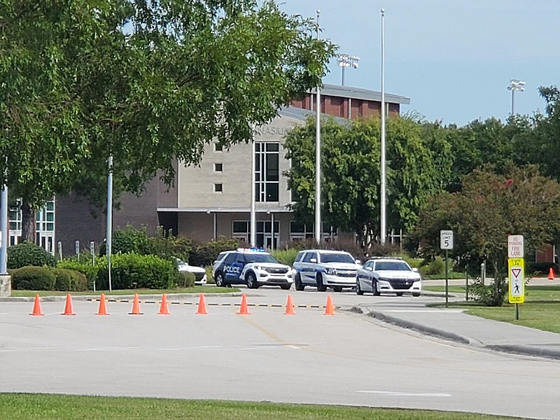 Police cruisers are seen Thursday at the site of a fatal stabbing at Northside High School in Jacksonville, N.C.
(AP/The Daily News/Trevor Dunnell)