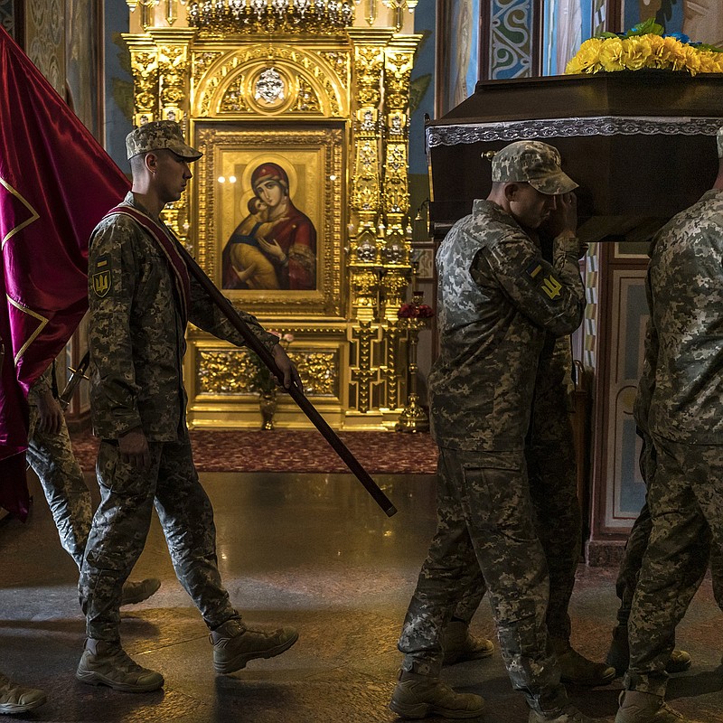 The casket containing the body of a Ukrainian Special Forces sniper and reconnaissance specialist known as Tengri is carried into St. Michael’s Golden-Domed Monastery for a funeral Saturday in Kyiv, Ukraine. Tengri’s true identity is being kept secret even after his death. Meanwhile, fighting around the Zaporizhzhia nuclear power plant knocked out primary power to the plant, putting its cooling equipment on a lower-voltage line.
(The New York Times/Brendan Hoffman)