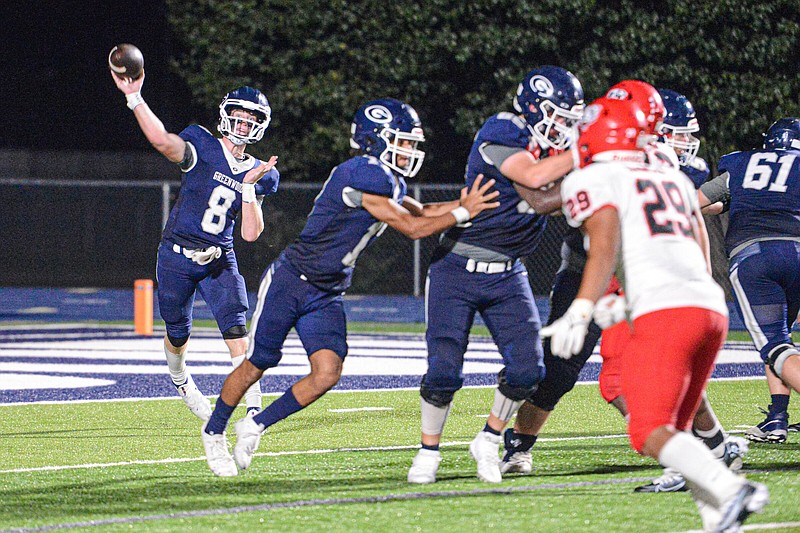 Greenwood quarterback Kane Archer (left) threw a 45-yard touchdown pass to Grant Karnes on the last play of the game to lead the Bulldogs to a come-from-behind 56-53 victory over Fort Smith Northside on Friday night. The Bulldogs trailed 53-35 with 4:00 left in the fourth quarter.
(NWA Democrat-Gazette/Hank Layton)