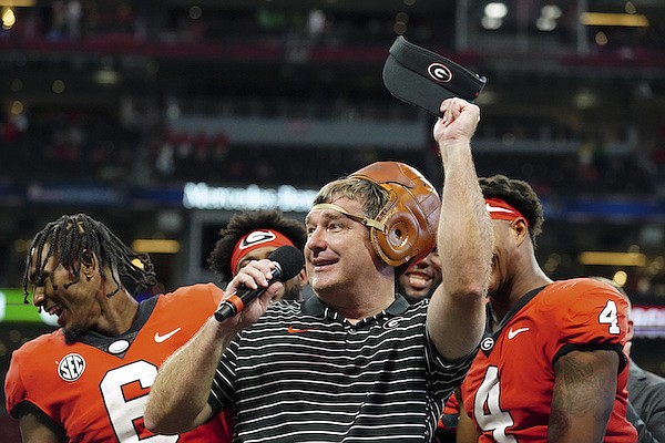 Georgia coach Kirby Smart wears the "Old Leather Helmet" after Georgie defeated Oregon during an NCAA college football game Saturday, Sept. 3, 2022, in Atlanta. (AP Photo/John Bazemore)