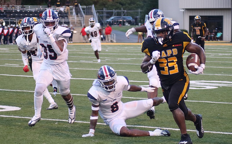 UAPB running back Kayvon Britten races past Ryan Quinney (35) and Jeffrey Johnson (8) of Lane College in the first half Saturday at Simmons Bank Field at Golden Lion Stadium. (Special to The Commercial/Jamie Hooks)