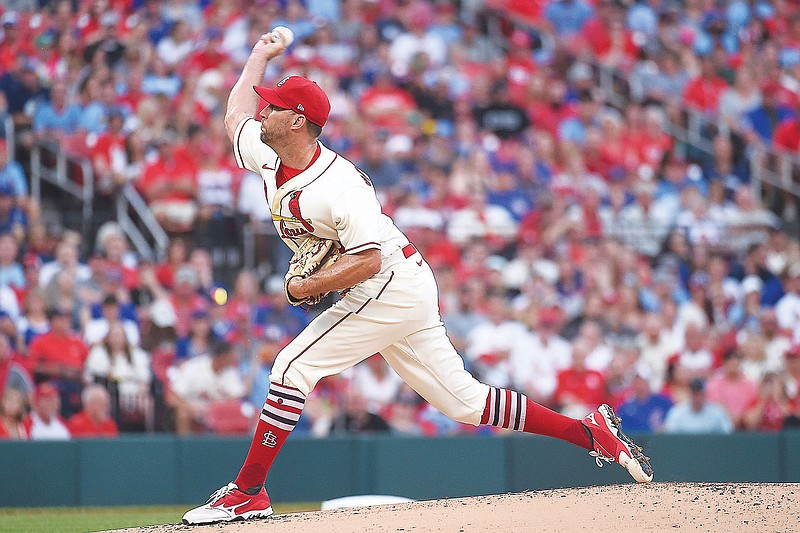 Cardinals starting pitcher Adam Wainwright throws during Saturday night's game against the Cubs at Busch Stadium in St. Louis. (Associated Press)