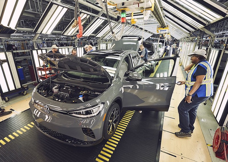 Contributed photo by Volkswagen / Volkswagen Chattanooga employees work on an ID.4 as production has begun on the electric SUV at the plant.