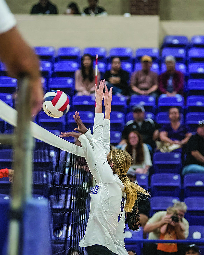Davin James leads a double block at the net for El Dorado against Little Rock Hall. The Lady Wildcats travel to Hall on Tuesday before hosting Hot Springs Thursday at Wildcat Arena.