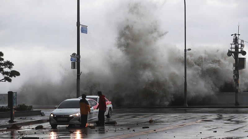 Waves crash over the breakwater in Busan, South Korea, Tuesday, Sept. 6, 2022. Thousands of people were forced to evacuate in South Korea as Typhoon Hinnamnor made landfall in the country's southern regions on Tuesday, unleashing fierce rains and winds that destroyed trees and roads, and left more than 20,000 homes without power. (Sohn Hyung-joo/Yonhap via AP)