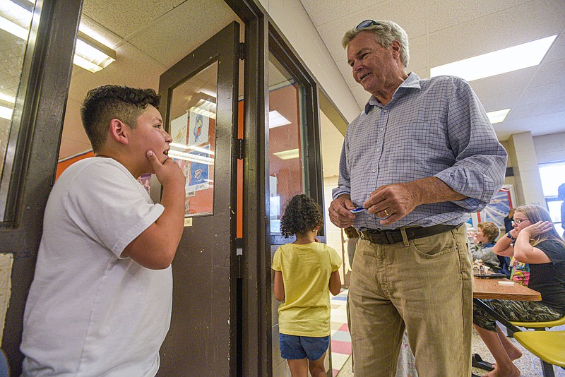 Jerry Glidewell, executive director of the Fort Smith Boys & Girls Club, visits with Cesar Valencia, 11, on Thursday, August 25, 2022, at the Bill Jeffrey Memorial Boys & Girls Club in Fort Smith. After 43 years with the organization, Glidewell is retiring in September. Beth Presley, a longtime community leader in the city, will succeed Glidewell. Visit nwaonline.com/220828Daily/ for today's photo gallery..(NWA Democrat-Gazette/Hank Layton)