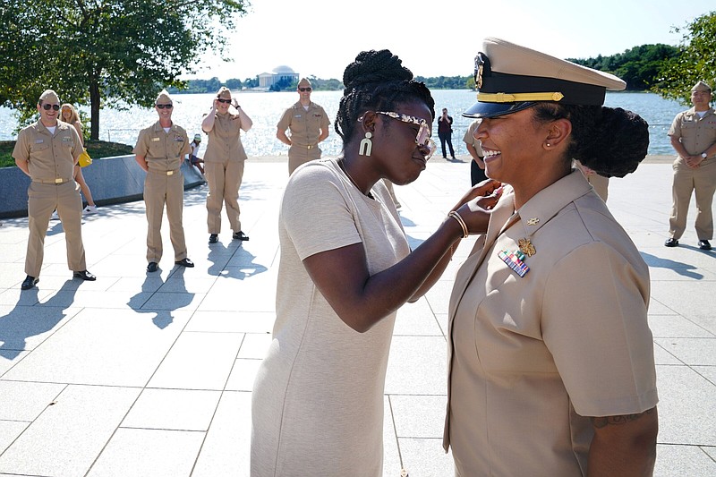 Lt. Cmdr. Brittni N. King (right) a Pine Bluff native, is pinned at a promotion ceremony at the Martin Luther King Jr. Memorial at Washington, D.C. on August 30. 
(Special to The Commercial/Navy Office of Community Outreach)